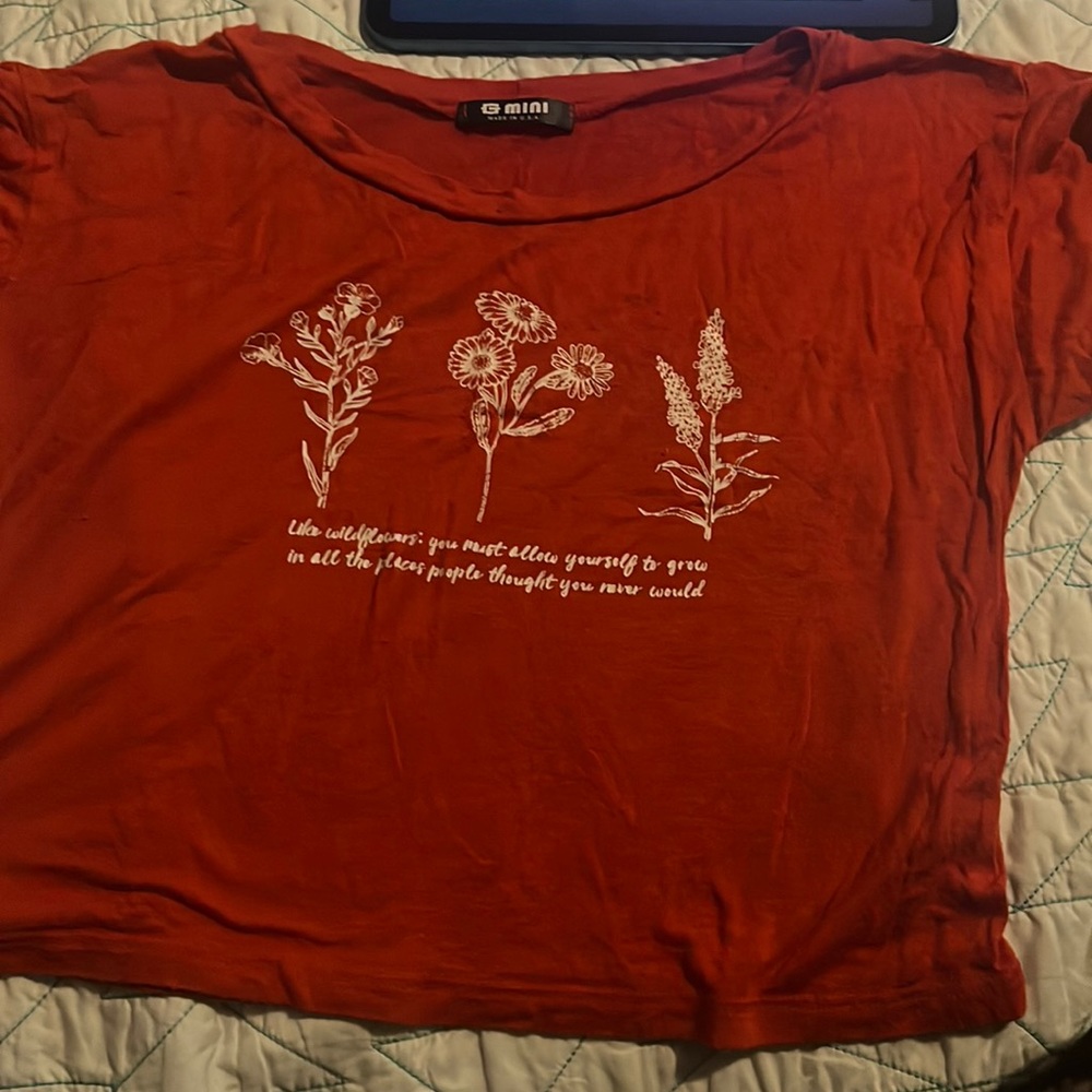 Red/ orange crop top with flowers and a quote size small.